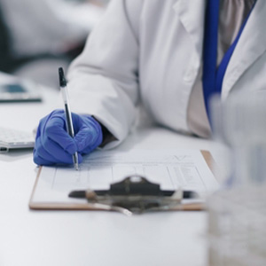 Scientist/doctor reviewing a chart, related to a Medical Child Abuse investigation and family protection in Michigan law. 
